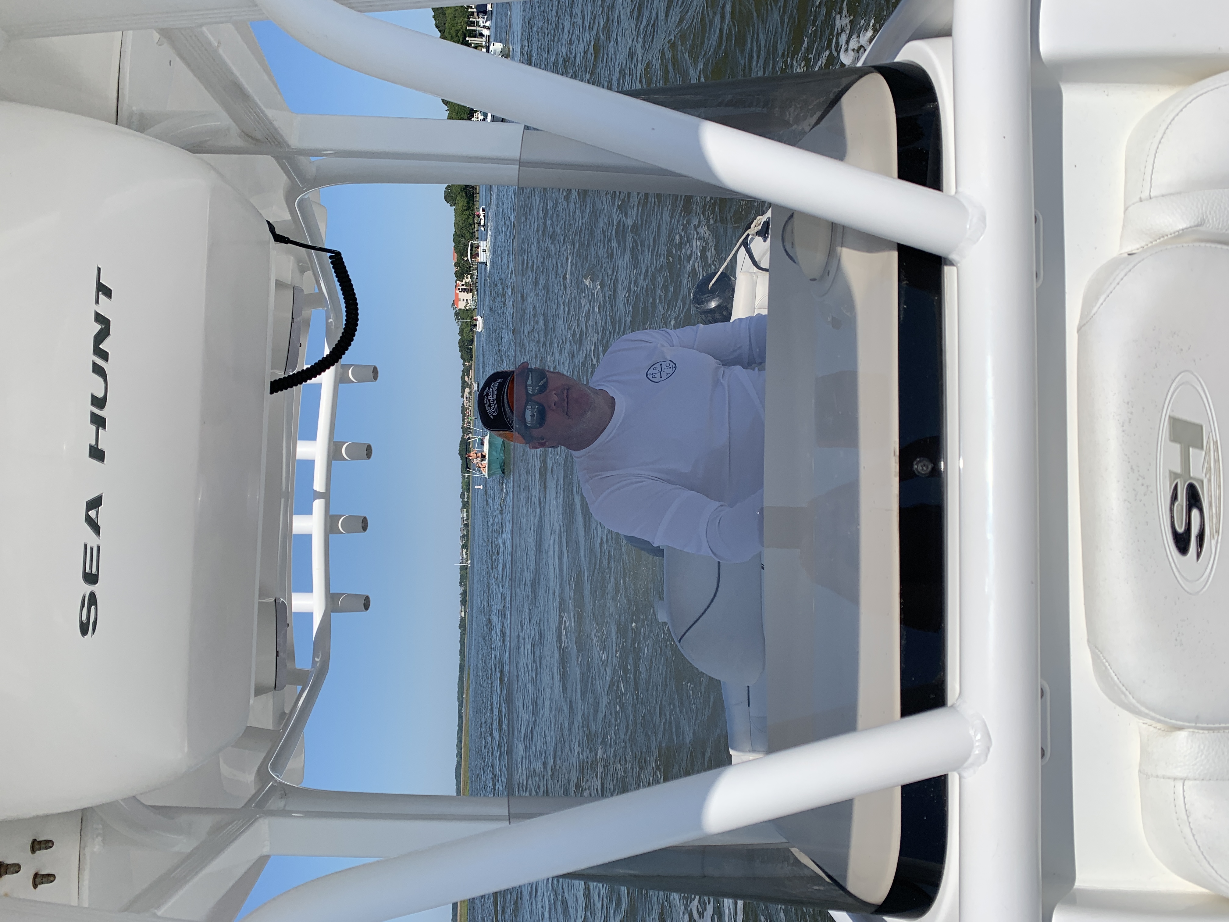 Captain at the helm preparing guests for a day on the water.