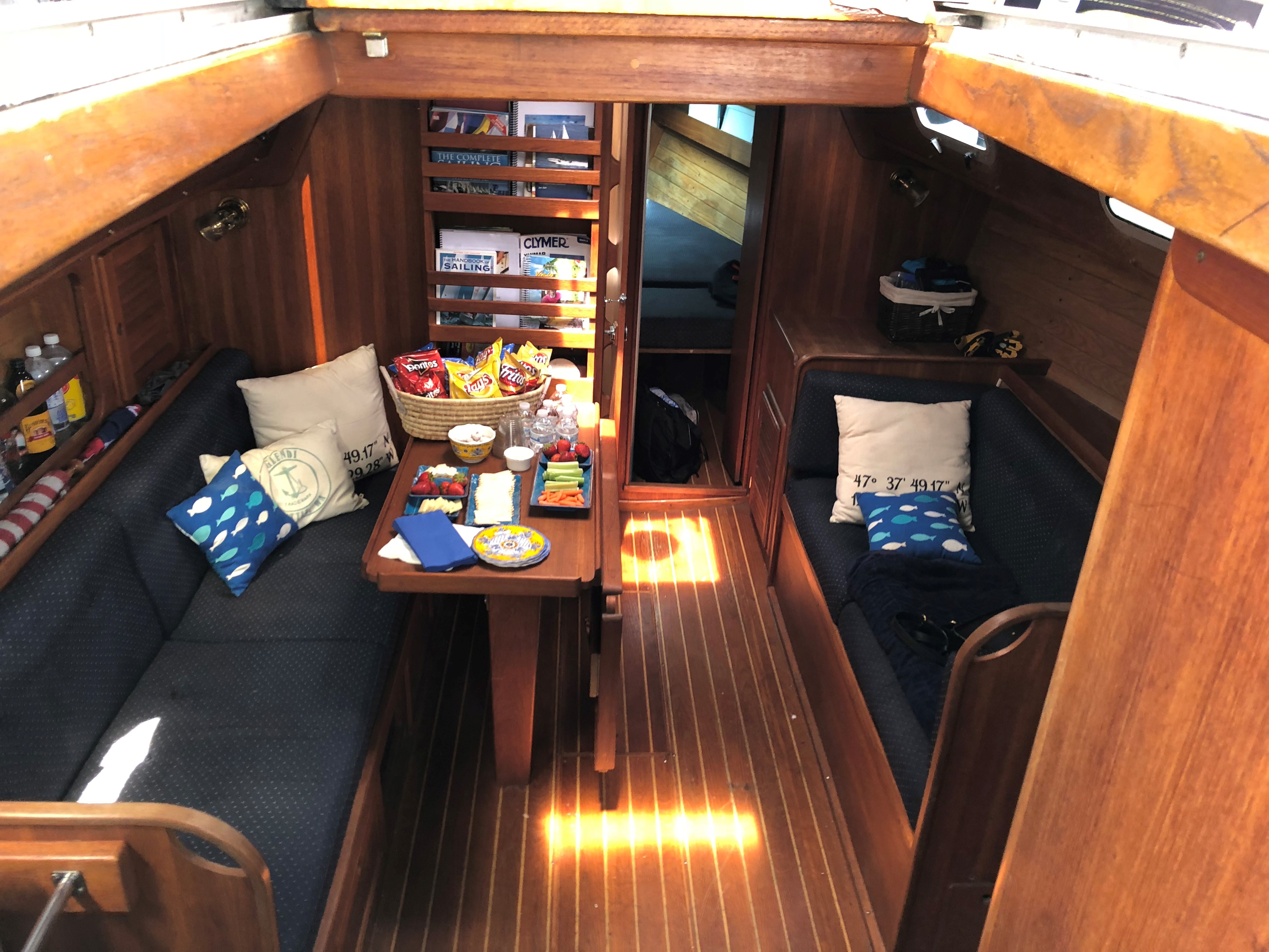 Overnight charter cabin stocked with snacks, fruit, and refreshments.