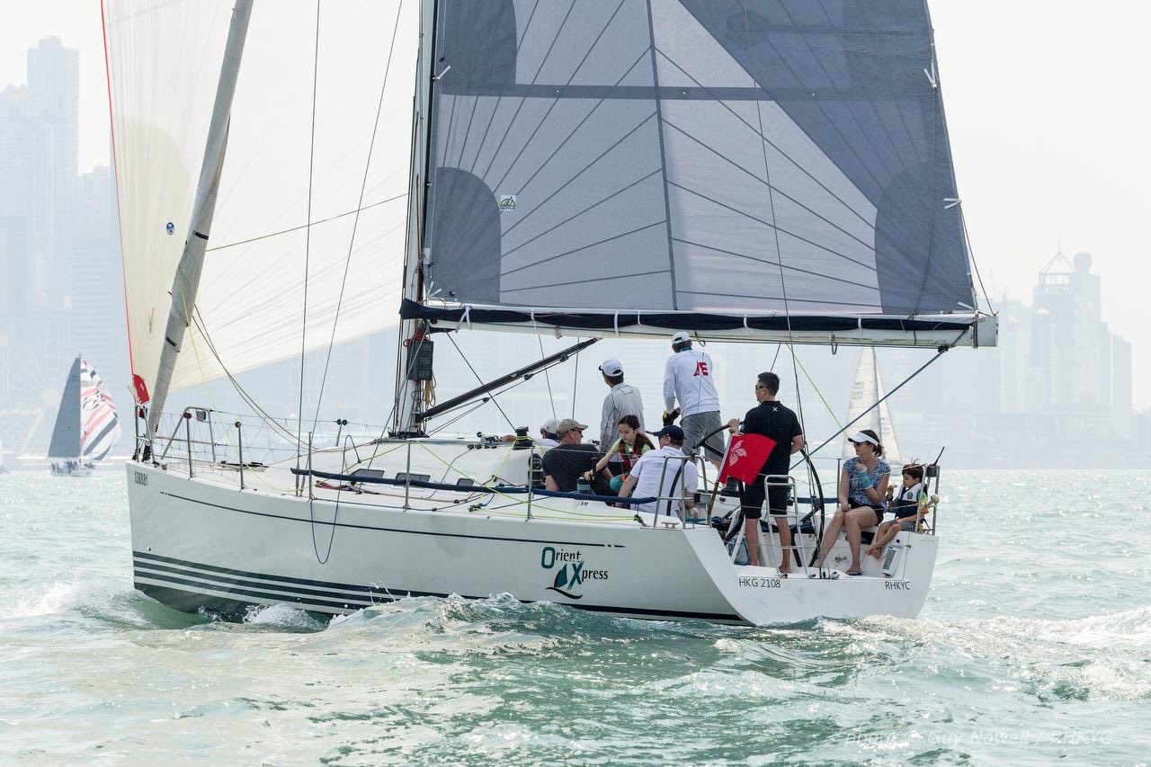 Crew working together under sail during a fast-paced training run.