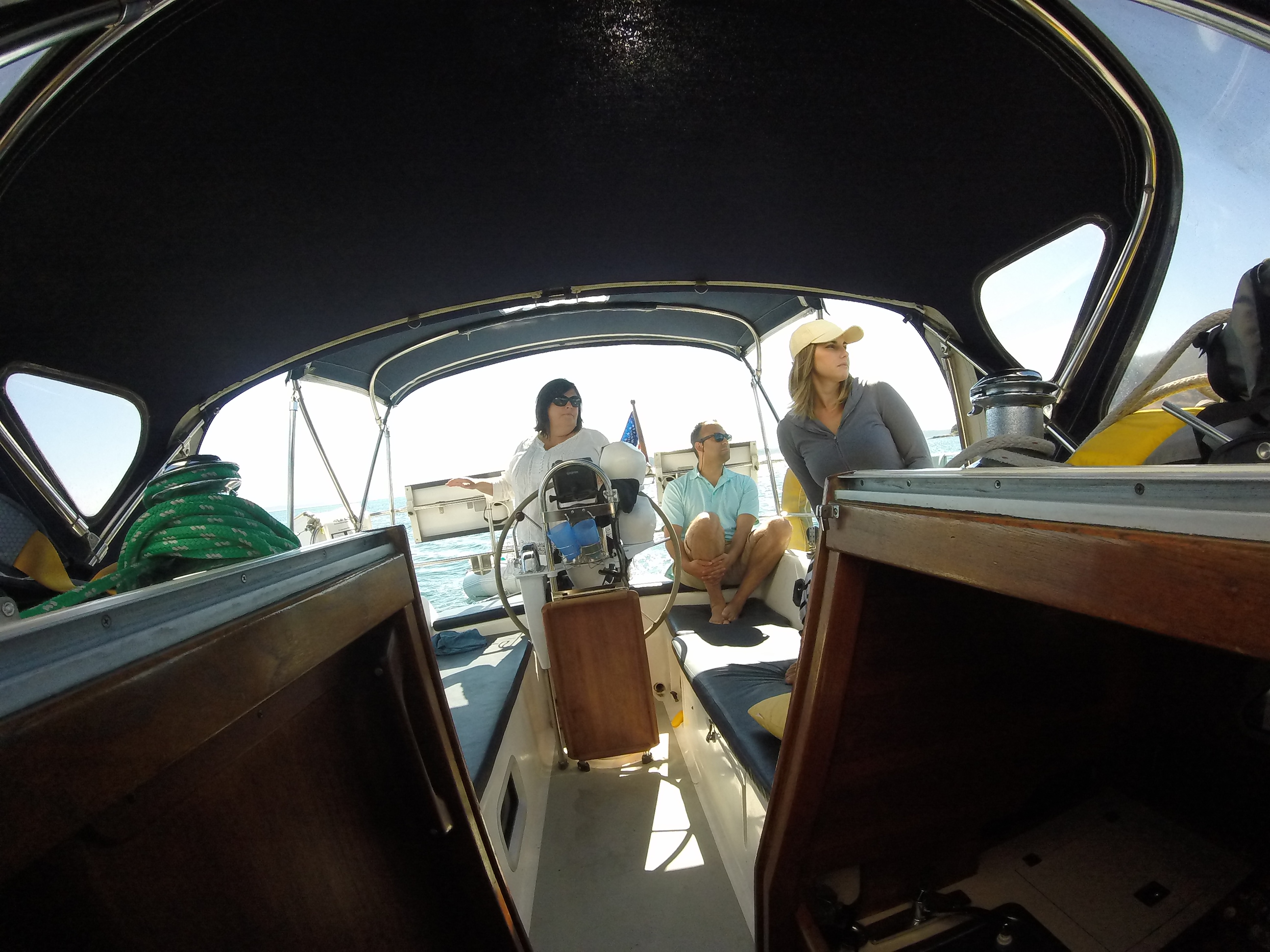 Weekend charter guests enjoying time together aboard the sailboat.